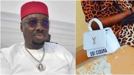 Nothing person no go see: Obi Cubana shares hilarious photo of a lady's designer bag with his name on it