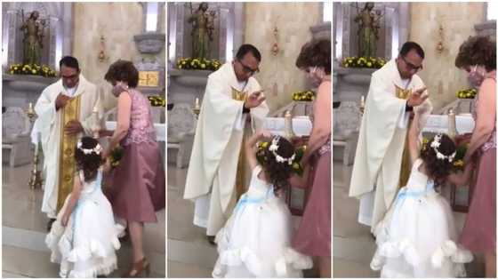 Funny moment little girl gives Catholic priest high-five during prayer session, video causes frenzy