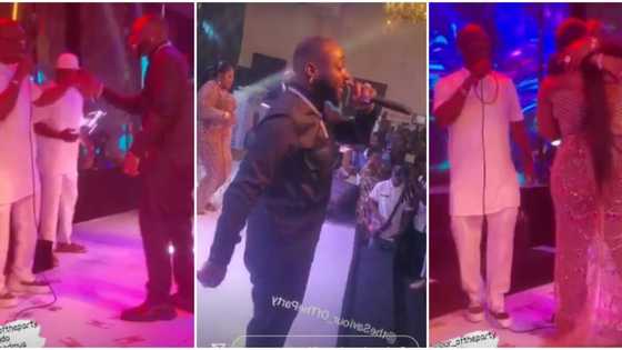 Davido dances with KWAM 1 at Eniola Badmus' party, gives actress tight hug as she sprays both singers on stage