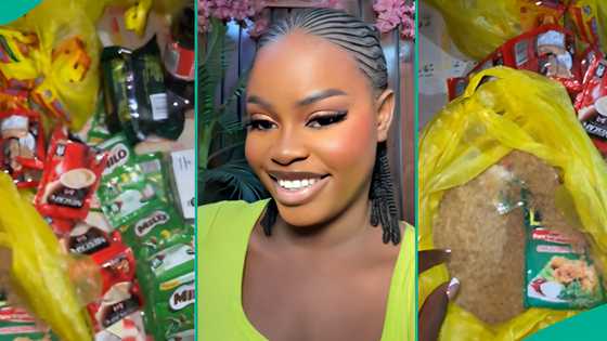 Lady receives foodstuffs as first timer at Salvation Ministries home cell meeting, shares location