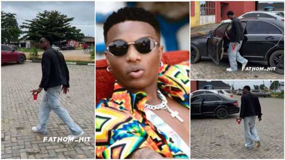 "He's accurate": Nigerian man walks like Wizkid, copies his move, holds cup