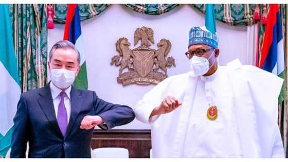 BREAKING: Amid second wave of COVID-19, Chinese minister lands in Abuja, Buhari reacts (photos)