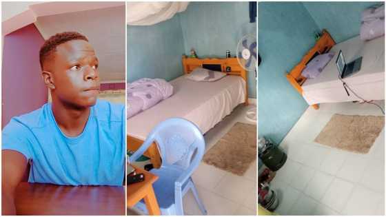 Young man sets up humble room with standing fan, gas cooker & centre rug to make it his "palace"