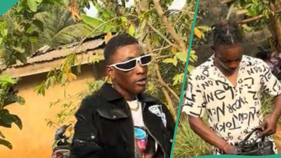 Young man brings out bundles of cash, gifts singer and children in public