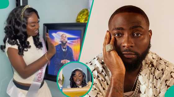 Davido: Video as lady loses composure after receiving OBO's portrait as birthday gift