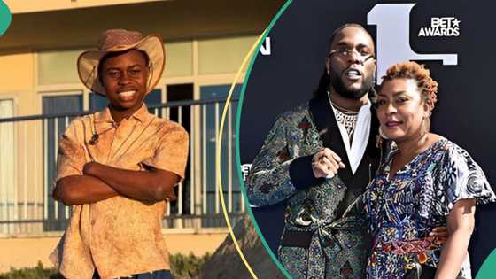 Burna Boy's mum ignores Peller at fashion show after he tried to shake her, video trends online