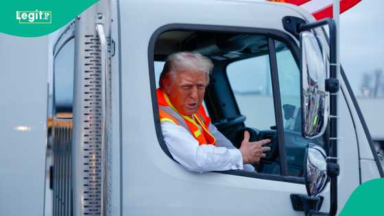 Trump dresses as sanitation worker at Wisconsin rally to slam Biden's "garbage" comment