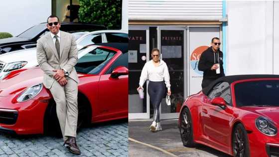 Savage: Alex Rodriguez proudly poses next to expensive red Porsche he had gifted J Lo