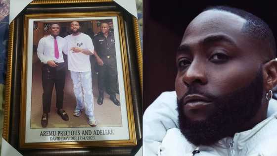 "My children will see it": Young man who snapped picture with Davido frames the image, photo goes viral