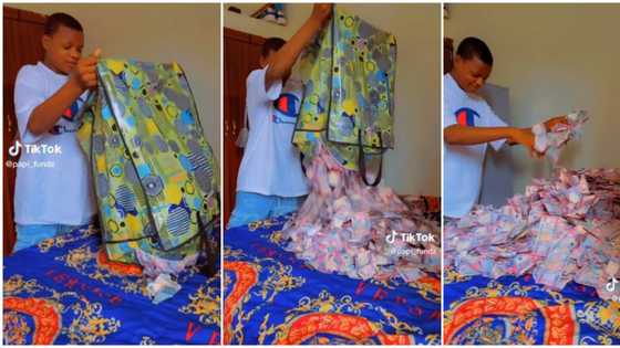 "So na you carry our money": Young man opens 'Ghana Must Go bag,' flaunts lots of cash he got on his birthday
