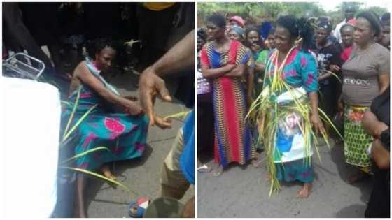Check out what angry mob did to woman accused of witchcraft for allegedly killing people in Abia (photos)