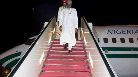 PHOTOS: President Buhari Arrives From SA Summit