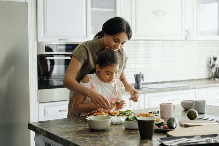 demonstration method of teaching happening at home between a mother and daughter