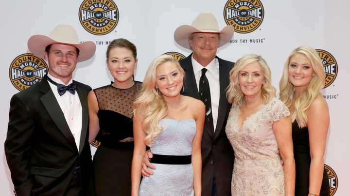 A photo of Alan Jackson's daughters and wife, capturing the essence of their bond and support for him